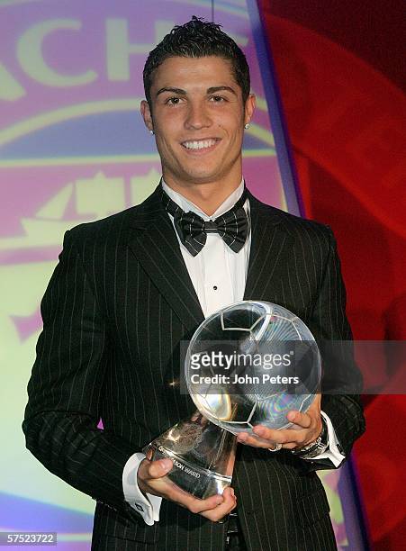 Cristiano Ronaldo of Manchester United poses with the Goal of the Year award at the annual Player of the Year awards dinner at Old Trafford on May 3,...