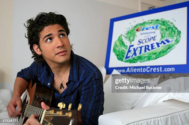 Musicians Julio Ramirez plays guitar at the press conference to introduce Crest Whitening Plus Scope Extreme Toothpaste and the launch of...