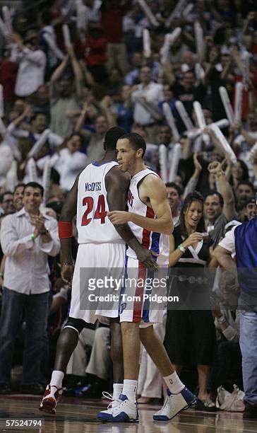 Antonio McDyess of the Detroit Pistons congratulates teammate Tayshaun Prince on his half court shot against the Milwaukee Bucks in game five of the...