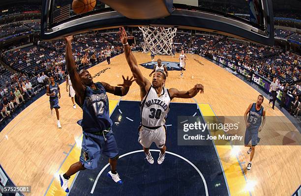 Ronald Dupree of the Minnesota Timberwolves goes to the basket against Dahntay Jones of the Memphis Grizzlies on April 11, 2006 at the FedExForum in...