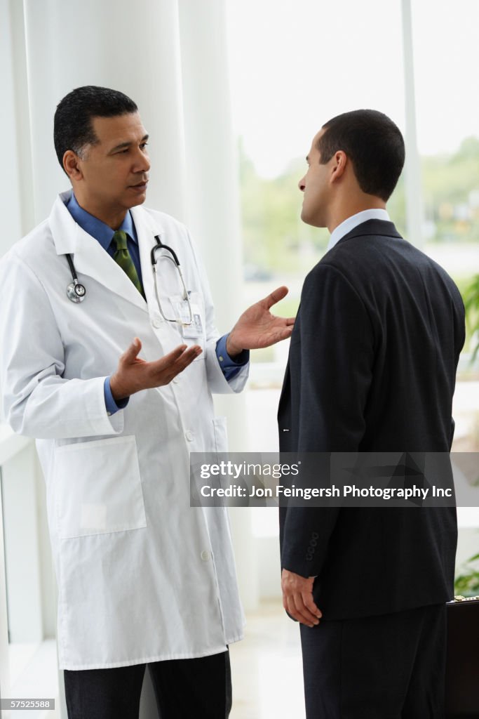 Doctor talking to a businessman