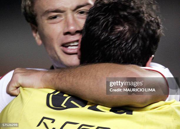 Uruguayan Diego Lugano , of Sao Paulo FC, hugs teammate goalkeeper and captain Rogerio Ceni while celebrating their victory against Palmeiras during...