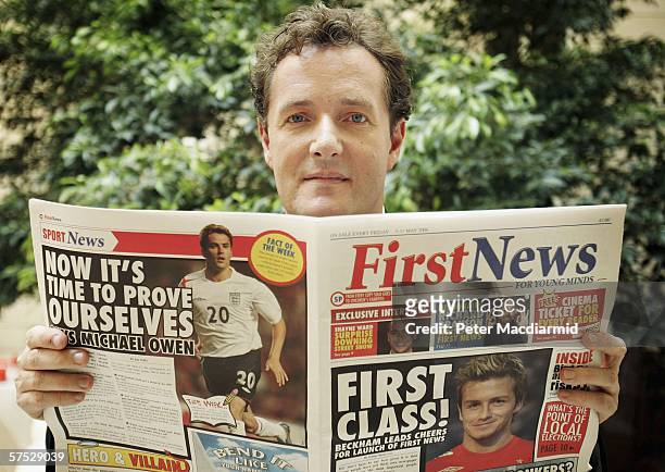 Former editor of the Daily Mirror newspaper Piers Morgan holds a copy of his new newspaper for the young readers 'First News' on May 4, 2006 in...