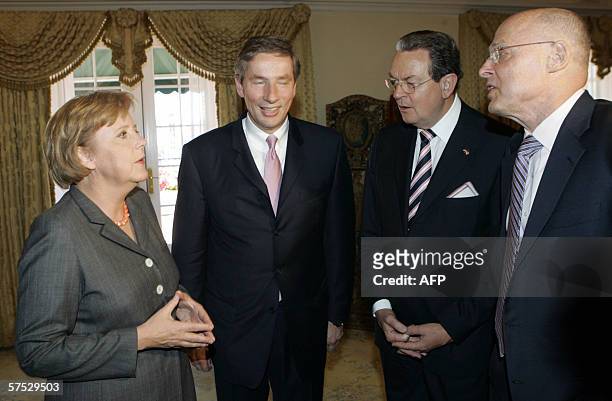New York, UNITED STATES: German Chancellor Angela Merkel meets 04 May with Jurgen R. Thurman , President of the Federation of German Industries,...
