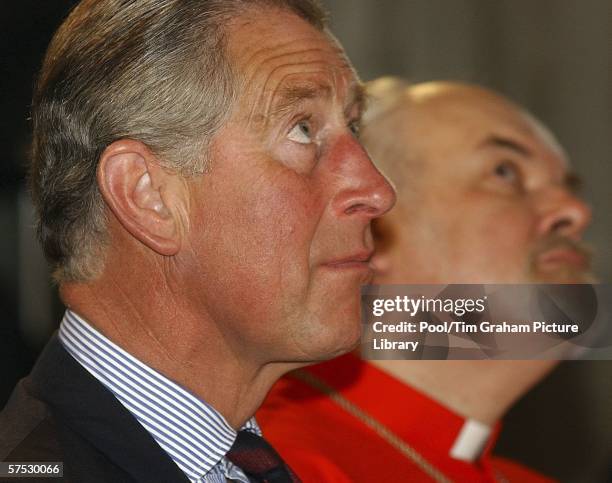 Prince Charles, Prince of Wales is accompanied by Richard Chartres, the Bishop of London at the opening of 'The Tent', an interfaith meeting space at...