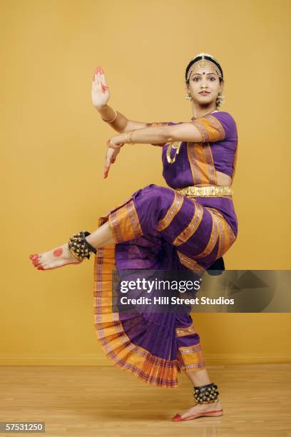 indian woman dancing in traditional dress - indian dance stock pictures, royalty-free photos & images