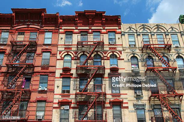 usa, new york city, manhattan, lower east side, typical apartment building facades with external staircases - lower east side manhattan stock pictures, royalty-free photos & images