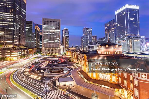 tokyo city with business street at night - tokyo station stock pictures, royalty-free photos & images