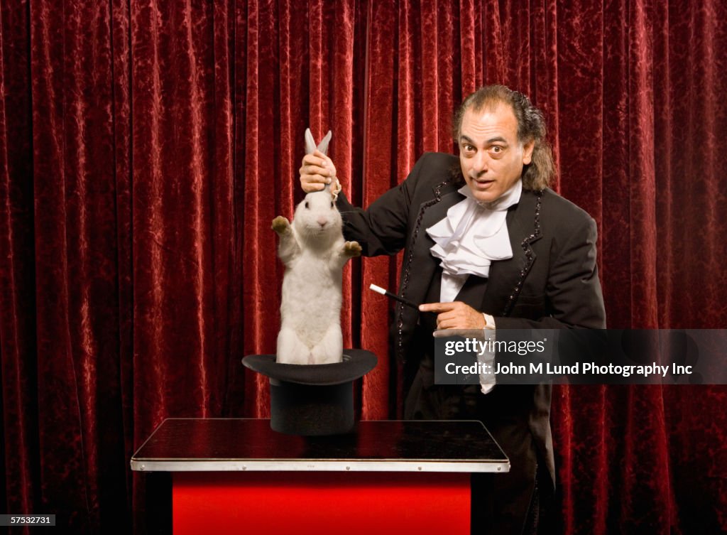 Magician pulling a rabbit out of a hat