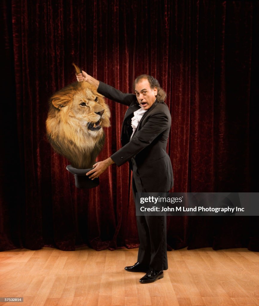 Magician pulling a lion out of a hat