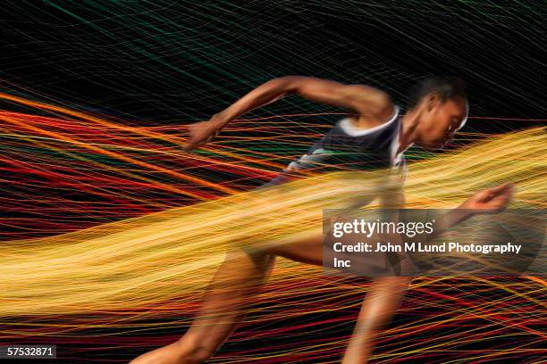 Run Through Thread Female Athlete Running Through Threads Of Color High-Res Stock Photo ...