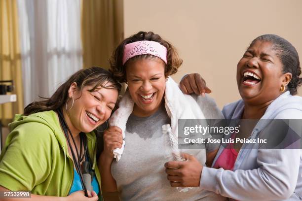 women laughing together - dominican ethnicity stock pictures, royalty-free photos & images