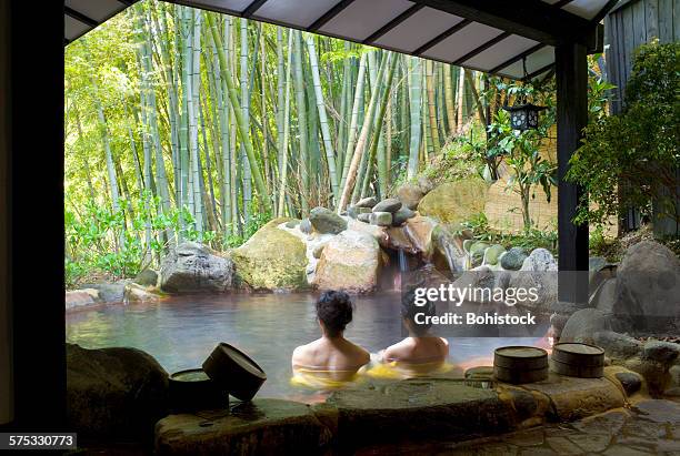 women bathing at hot spring resort - onsen japan stock pictures, royalty-free photos & images