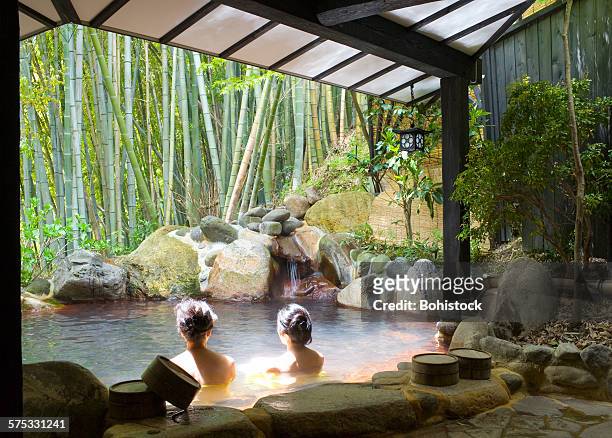 women bathing at hot spring resort - varm källa bildbanksfoton och bilder