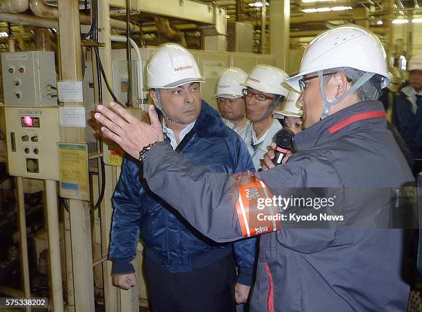 Iwaki, Japan - Carlos Ghosn , president of Nissan Motor Co., inspects the company's plant in Iwaki, Fukushima Prefecture, on March 29, 2011. The area...