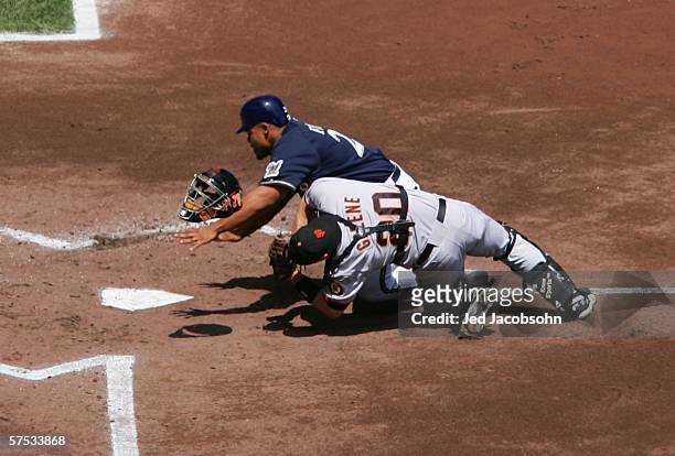 Todd Greene of the San Francisco Giants collides with Prince Fielder of the Milwaukee Brewers in the first inning on May 4, 2006 at Miller Park in...