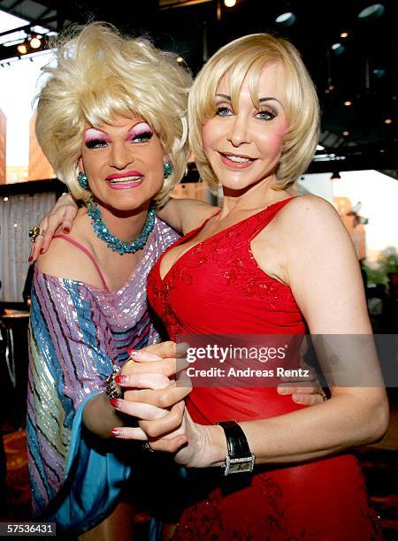 Porn queen Dolly Buster and drag queen Olivia Jones arrive at the Premiere of 'Belle et Fou' during the opening of the 'Belle et Fou' Theater on May...