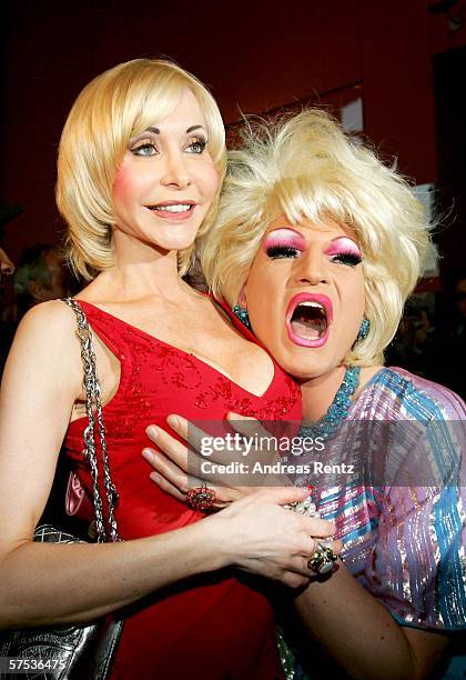 Porn queen Dolly Buster and drag queen Olivia Jones arrive at the Premiere of 'Belle et Fou' during the opening of the 'Belle et Fou' Theater on May...
