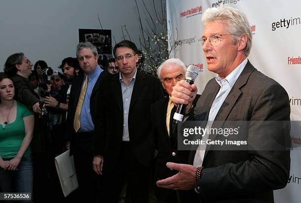 Actor Richard Gere speaks as Chief Executive Officer of Getty Images Jonathan Klein and Jack Valenti , former head of the Motion Picture Association...