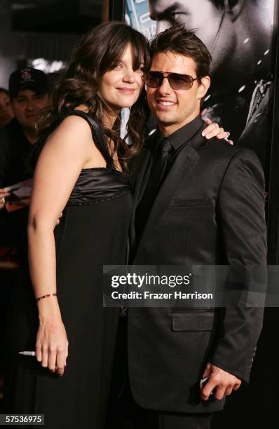 Actors Katie Holmes and Tom Cruise pose on the red carpet at the Paramount Pictures fan screening of "Mission: Impossible III" held at the Grauman's...