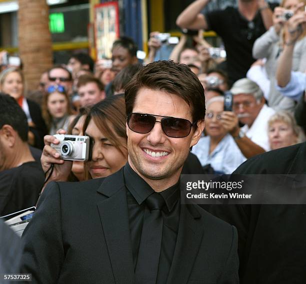 Actor Tom Cruise poses with fans as he arrives at the Paramount Pictures fan screening of "Mission: Impossible III" held at the Grauman's Chinese...