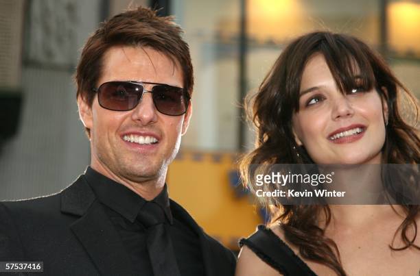 Actor Tom Cruise and actress Katie Holmes arrive at the Paramount Pictures fan screening of "Mission: Impossible III" held at the Grauman's Chinese...