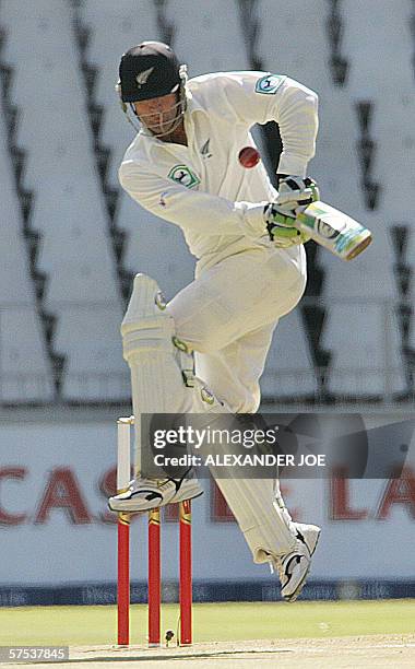 Johannesburg, SOUTH AFRICA: New Zealand's batsman Nathan Astle plays a shot delivered by South Africa's fast bowler Makhaya Ntini on day One of the...