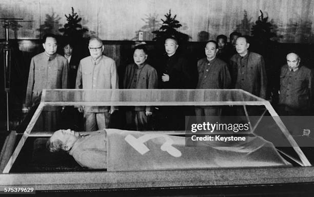 Chinese leaders viewing the body of Chairman Mao Tse-Tung lying in state, in Peking, September 1976. Printed after the 1st anniversary of his death...