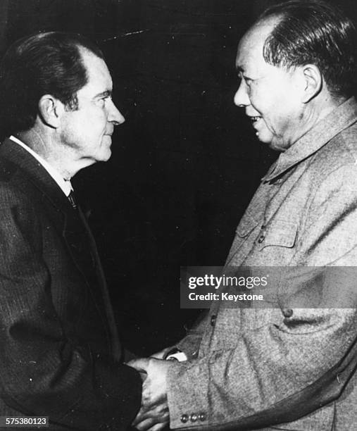 Chairman Mao Tse-Tung of China shaking hands with US President Richard Nixon, February 22nd 1972.