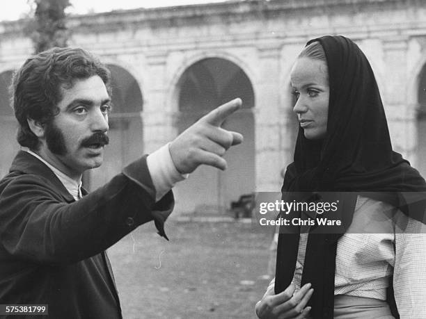 Italian model and actress Veruschka von Lehndorff being directed by a photographer, while modeling for the collection 'under the sea, on the sea, by...
