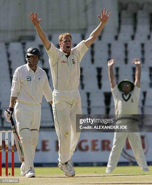 Johannesburg, SOUTH AFRICA: South African fast bowler Shaun Pollock celebrates getting out New Zealand's batsman Jacob Oram LBW on day one of the 3rd...