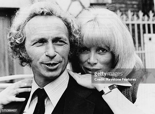 Portrait of actors Pierre Richard and Mireille Darc promoting their new film 'The Return of the Tall Blond Man', circa 1974.