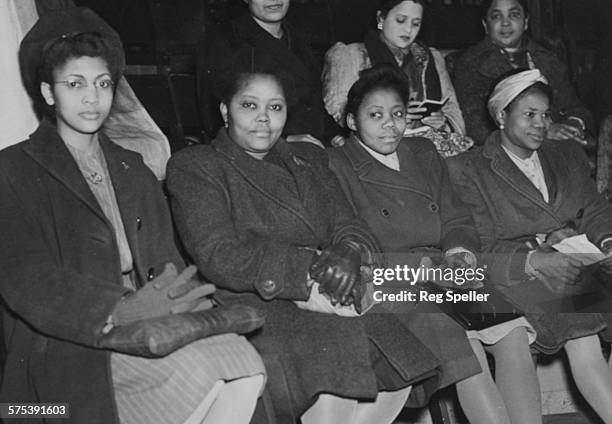 Delegates from all over the world at a meeting to celebrate International Women's Day; Marie Campbell , Miss Hazeley , Miss Inyang and Miss Ikpeme ,...