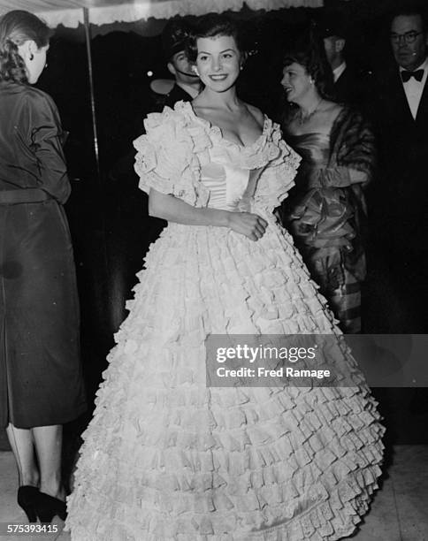 Actress Joan Rice wearing a ruffled gown as she attends the premiere of the film 'The Magic Box' at the Odeon, Leicester Square, September 18th 1951.