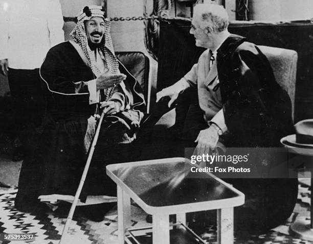 King Ibn Saud of Arabia talking to President Franklin Roosevelt aboard the USS Quincy at the Great Bitter Lake in the Suez Canal, Egypt, 14th...