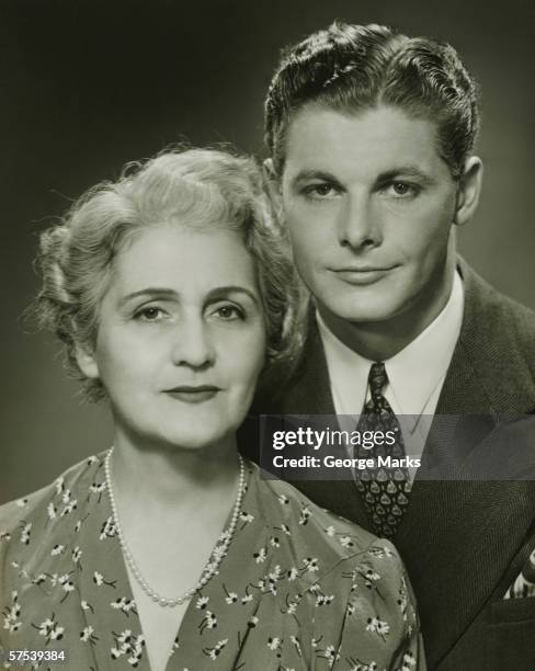 mother and adult son, formal portrait, in studio, (b&w), portrait - 1940's stock pictures, royalty-free photos & images