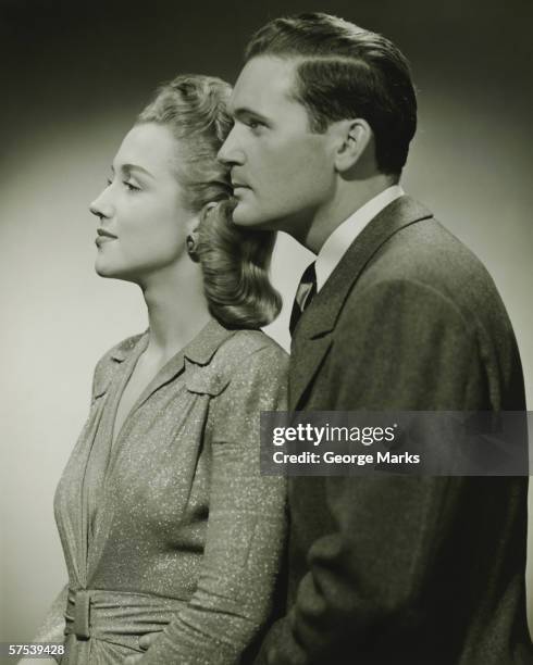 young couple in studio, (b&w), close-up - 1940's stock pictures, royalty-free photos & images