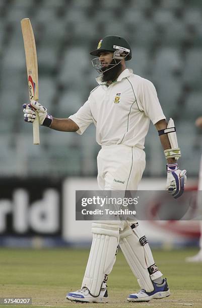 Hashim Amla of South Africa celebrates his 50 during day one of the third and final test match between South Africa and New Zealand at Wanderers...