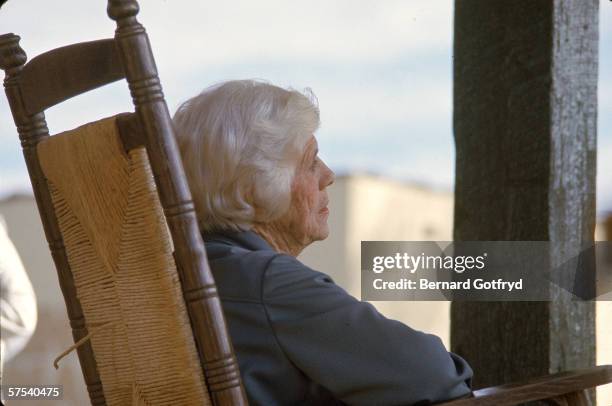 Portrait of American nurse and social activist Lillian Carter , mother of President Jimmy Carter, sitting in a rocking chair, 1970s. Miss Lillian, as...