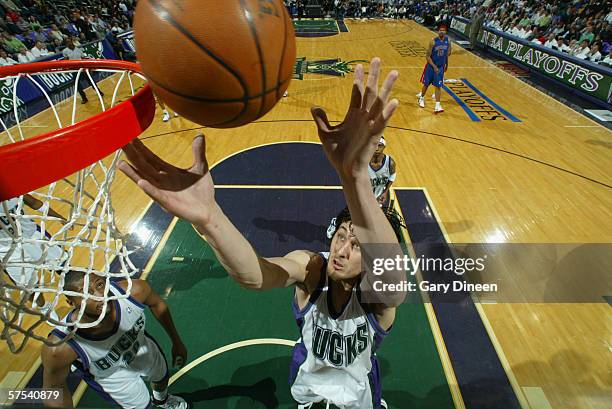 Andrew Bogut of the Milwaukee Bucks rebounds the ball against the Detroit Pistons in game five of the Eastern Conference Quarterfinals during the...