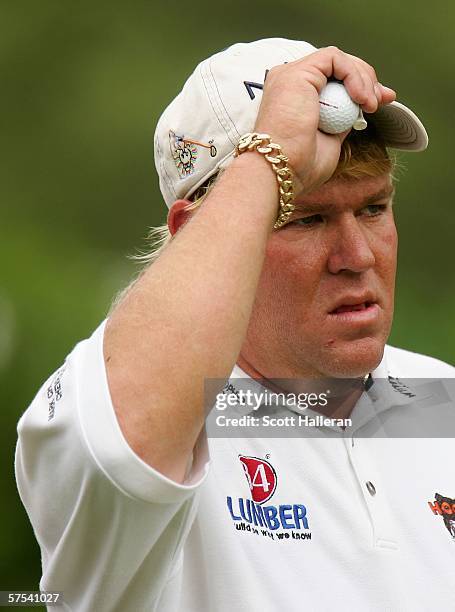 John Daly waits on the second tee during the second round of the Wachovia Championship at Quail Hollow Club on May 5, 2006 in Charlotte, North...