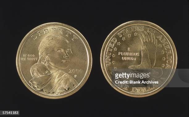 The head and tail sides of the United States dollar coin, 2000. The head features the likeness of Sacagawea, Native American guide and translator for...