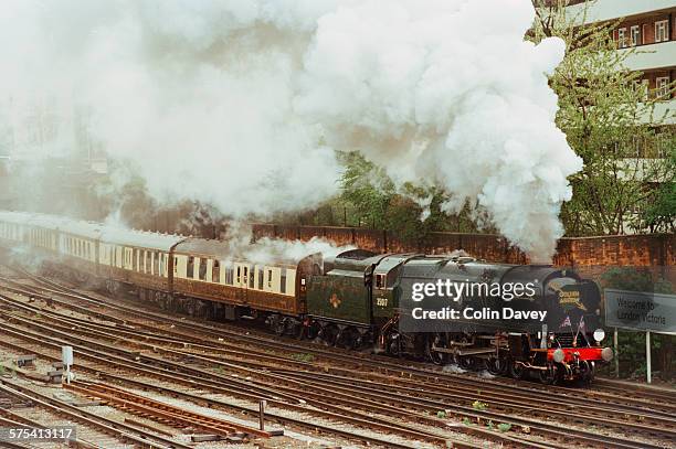 The Golden Arrow pulls into Victoria Station in London, pulling the Orient Express coaches behind it, 28th April 1996.