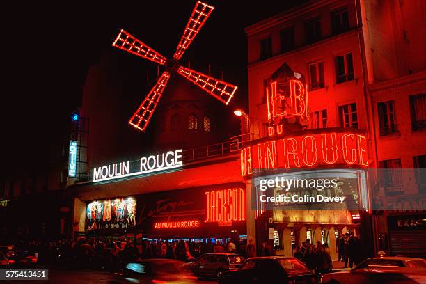 The exterior of the Moulin Rouge cabaret in Paris, France, 6th March 1992. It is advertising the La Toya Jackson revue 'Formidable'.