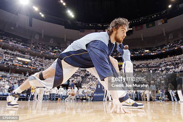 Pau Gasol of the Memphis Grizzlies stretches before play against the Dallas Mavericks in game three of the Western Conference Quarterfinals during...