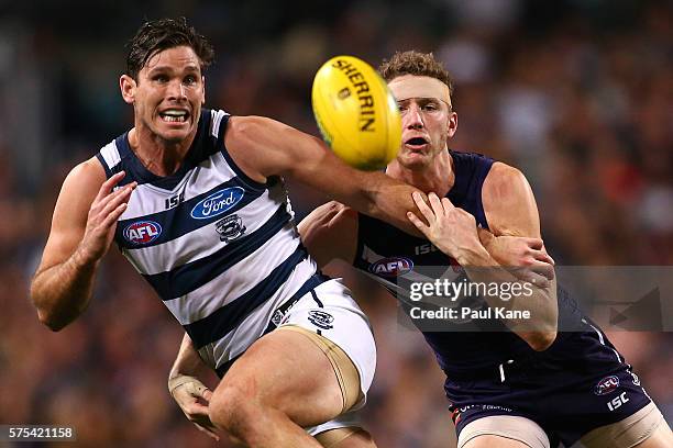 Tom Hawkins of the Cats and Zac Dawson of the Dockers contest for the ball during the round 17 AFL match between the Fremantle Dockers and the...