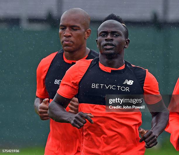 Sadio Mane with Andre Wisdom of Liverpool during a training session at Melwood Training Ground on July 15, 2016 in Liverpool, England.