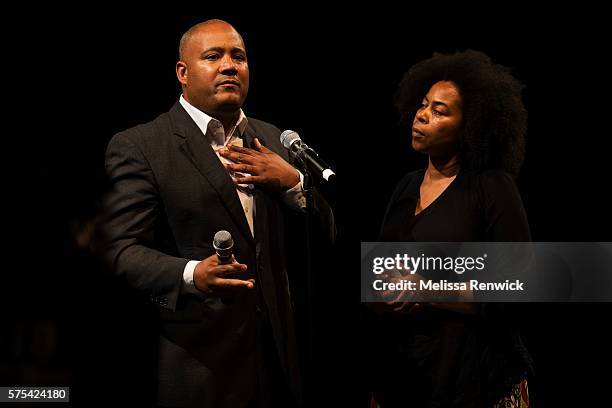 Dionne Renee listens to Minister Michael Coteau answer her question during an anti-racism meeting at Daniel's Spectrum with Premier Kathleen Wynne...