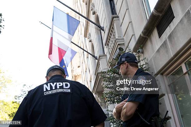 New York City Police Department counterterrorism officers stand guard outside the French Consulate, July 15, 2016 in New York City. Following the...