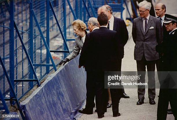 Prime Minister of the United Kingdom, Margaret Thatcher , visiting Hillsborough Stadium in Sheffield, the day after the stampede which resulted in...